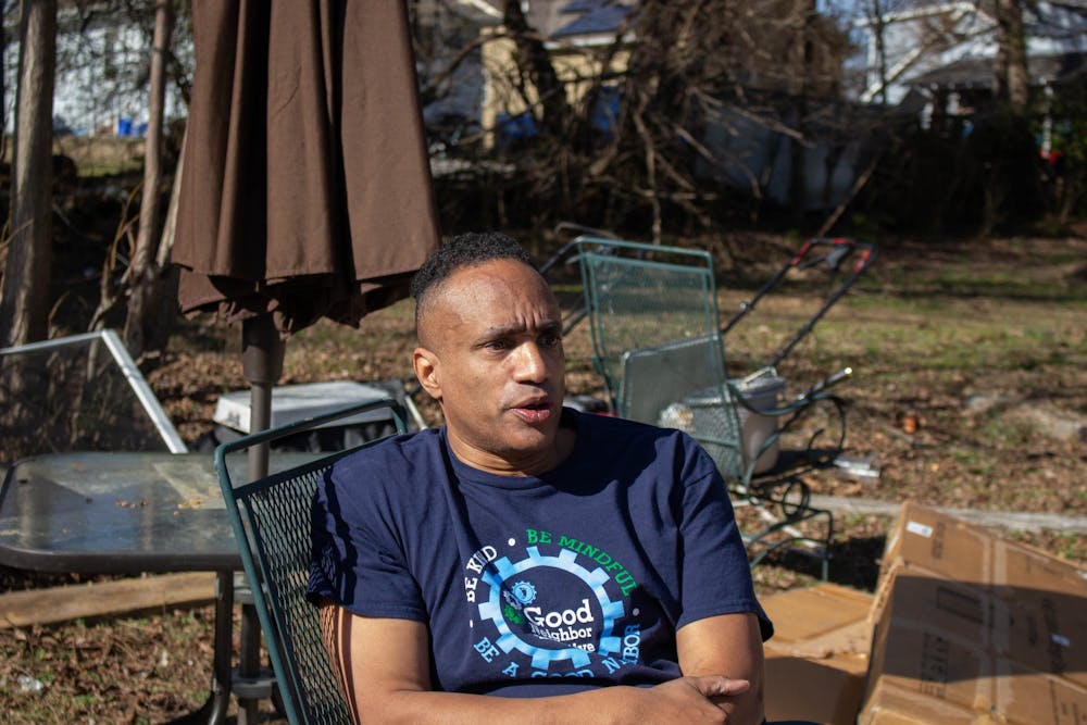 Loy Long Jr. sits in a chair as he speaks, facing the right.